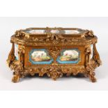 A SUPERB 19TH CENTURY FRENCH ORMOLU JEWELLERY BOX with SEVRES PORCELAIN PANELS with red velvet