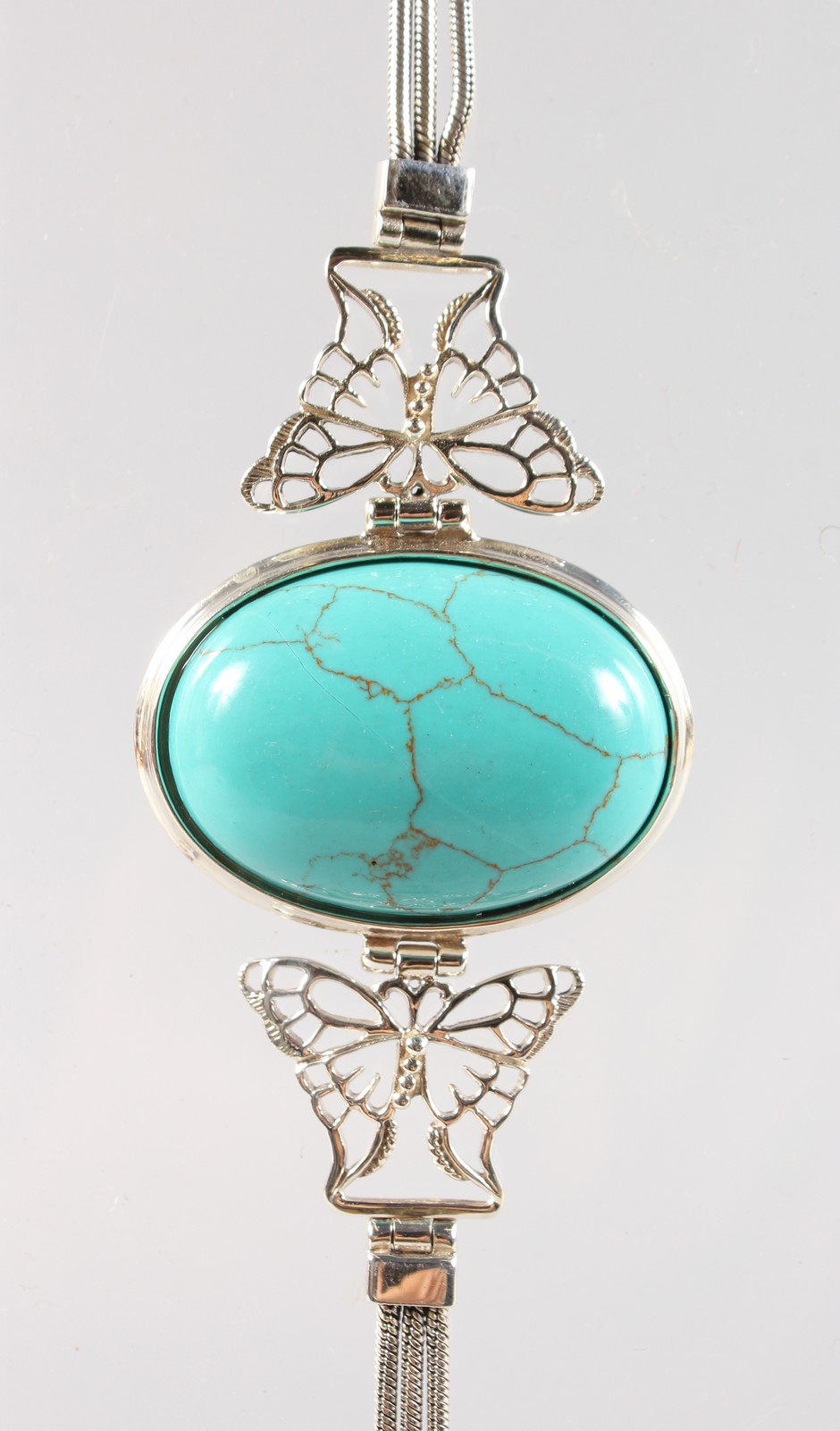 A TURQUOISE SILVER MOUNTED BRACELET.