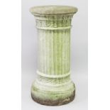 A CARVED STONE CIRCULAR PEDESTAL. 2ft 6ins high, 1ft 3ins diameter.