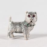 A SMALL SILVER NOVELTY TERRIER with glass eyes.