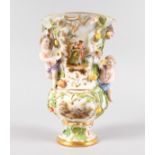 A GOOD MEISSEN TRUMPET SHAPED VASE, encrusted with fruit, flowers and two cupids. Cross swords