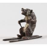 A VIENNA BRONZE BEAR ON SKIS. 2.5ins long.