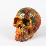 AN UNUSUAL CARVED GLASS SKULL. 6ins long.
