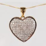 A 9CT WHITE GOLD PAVE DIAMOND SET HEART SHAPED PENDANT on chain.