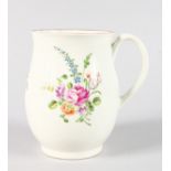 AN 18TH CENTURY WORCESTER FINE BELL SHAPED MUG painted with colourful flowers.