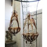 TWO WROUGHT IRON HANGING BASKETS. 2ft 0ins and 2ft 10ins.