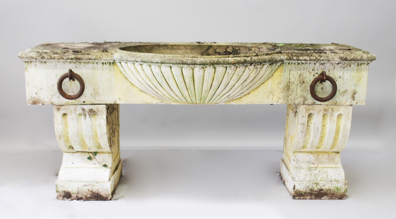 A LARGE PEDESTAL HORSE TROUGH, to imitate white marble, weathered and dirty, with shell water