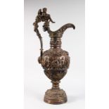 A LARGE PATINATED BRONZE EWER, of Neo Classical design, decorated with cherubs. 2ft 10ins high.