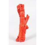 A CARVED RED JADE FIGURE OF GUANYIN. 7.5ins long.