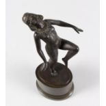 A GOOD SMALL ART DECO STYLE BRONZE, depicting a nude female figure posing on one leg, mounted on