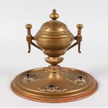 A FRENCH BRASS JEWELLED CIRCULAR INKWELL AND COVER.