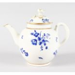 AN 18TH CENTURY WORCESTER TEAPOT AND COVER painted with dry blue flowers.