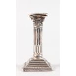 A CORINTHIAN COLUMN SILVER CANDLESTICK. 7cms high.