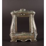 A STERLING SILVER ART NOUVEAU UPRIGHT PHOTOGRAPH FRAME decorated with scrolls and dolphins. 5ins