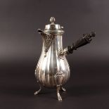 A FRENCH SILVER COFFEE POT with acanthus spout and wooden handle by CARDEILHAC PARIS.