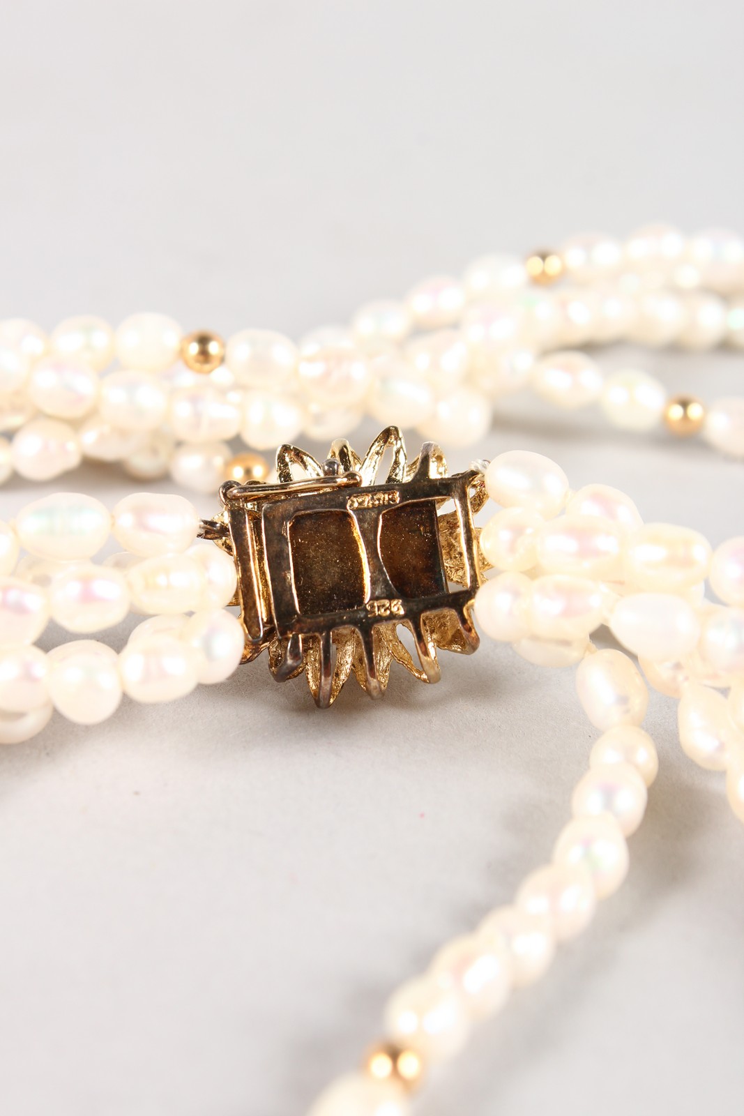 A THREE STRAND PEARL NECKLACE with silver clasp. - Image 3 of 4