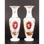 A PAIR OF VICTORIAN MILK GLASS VASES with gilt decoration on Roman portraits. 9ins high.