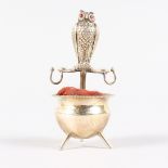 AN OWL STANDING ON A CAULDRON PIN CUSHION. Sheffield 1901. Maker: Walker & Hall. 8.5cms high.