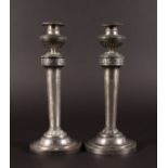 A PAIR OF SILVER CANDLESTICKS by SCHWABACHER. 9.5ins high.