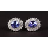 A LOVELY PAIR OF 18CT WHITE GOLD, DIAMOND AND TANZANITE CLUSTER EARRINGS.