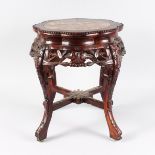 A CHINESE CARVED HARDWOOD AND MARBLE URN STAND, LATE 19TH/EARLY 20TH CENTURY, with a shaped top,