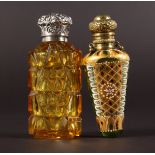 TWO VICTORIAN CUT GLASS AMBER AND ENAMEL SCENT BOTTLES with silver tops.