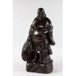 A LARGE HEAVY CARVED CHINESE ROSEWOOD BUDDHA FIGURE. 1ft 11ins high.