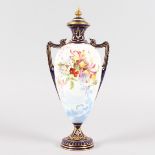 A ROYAL WORCESTER TWO HANDLED URN SHAPED VASE AND COVER, with leaded glaze, lake scene, and