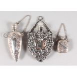 THREE SILVER PERFUME BOTTLES.