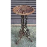 A SMALL CAST IRON TABLE. 2ft 4ins high.