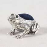 A SILVER FROG PIN CUSHION.