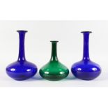 A PAIR OF BRISTOL BLUE DECANTERS and A GREEN DECANTER (3).