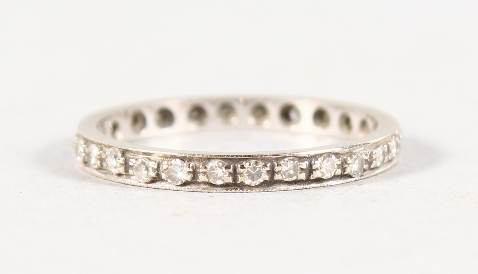 AN 18CT WHITE GOLD AND DIAMOND ETERNITY RING.