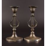 A PAIR OF EDWARD VII CANDLESTICKS with lyre stems, on oval bases. 8.5ins high. Sheffield 1907.