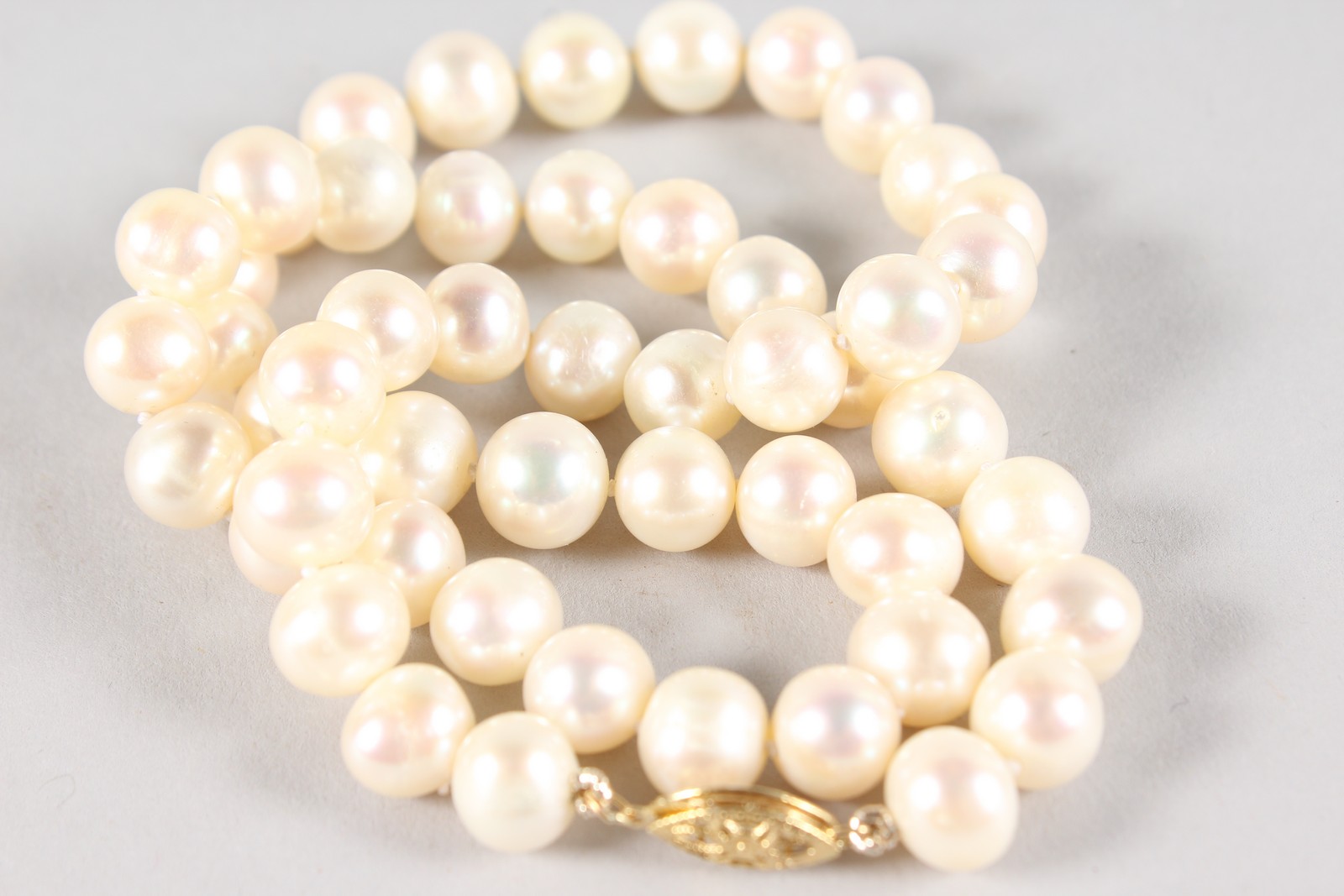 A STRING OF PEARLS with 14ct gold clasp. - Image 2 of 4