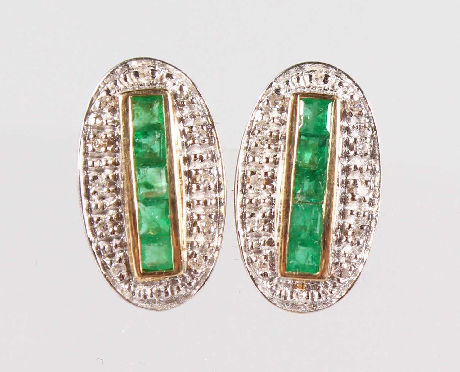 A PAIR OF 9CT GOLD, EMERALD AND DIAMOND EARRINGS.