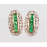 A PAIR OF 9CT GOLD, EMERALD AND DIAMOND EARRINGS.