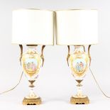 A GOOD PAIR OF SEVRES WHITE PORCELAIN URN SHAPED LAMPS, with gilt decoration, painted with reverse