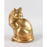 A BRASS SEATED CAT. 8.5ins high.