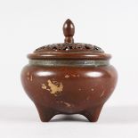 A SMALL CHINESE BRONZE GOLD SPLASH CIRCULAR CENSER AND COVER. 3ins diameter.