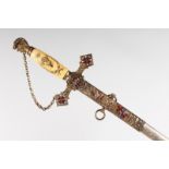A MASONIC SWORD, with ivorine grip and enamel decoration. 3ft 2ins long.
