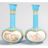 A SUPERB PAIR OF COALPORT BOTTLE VASES, with blue ground edged in gilt, painted with reverse