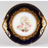 A LARGE SEVRES PORCELAIN TWO HANDLED DISH with blue and gilt border, the centre painted with three