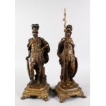 AFTER AUGUSTUS MOREAU A GOOD PAIR OF BRONZES OF SOLDIERS, carrying shields. Signed MOREAU. 14ins