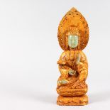 AN UNUSUAL GILDED CHINESE FIGURE OF A FEMALE DEITY, with carved jadeite face and hands.