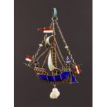 AN EDWARDIAN GOLD AND ENAMEL HENRY VIII BOAT "MARY ROSE", in original case, J. Dudley, 59 Osborne