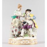 A SUPERB MEISSEN GROUP of A GALLANT AND LADY feeding a lamb, on an oval base. Cross swords mark in