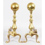 A GOOD PAIR OF 18TH-19TH CENTURY DUTCH BRASS ANDIRONS. 18.5ins high.