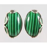 A PAIR OF SILVER AND MALACHITE CLIP ON EARRINGS.