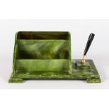 A GREEN BAKELITE TABLE DESK with pen.